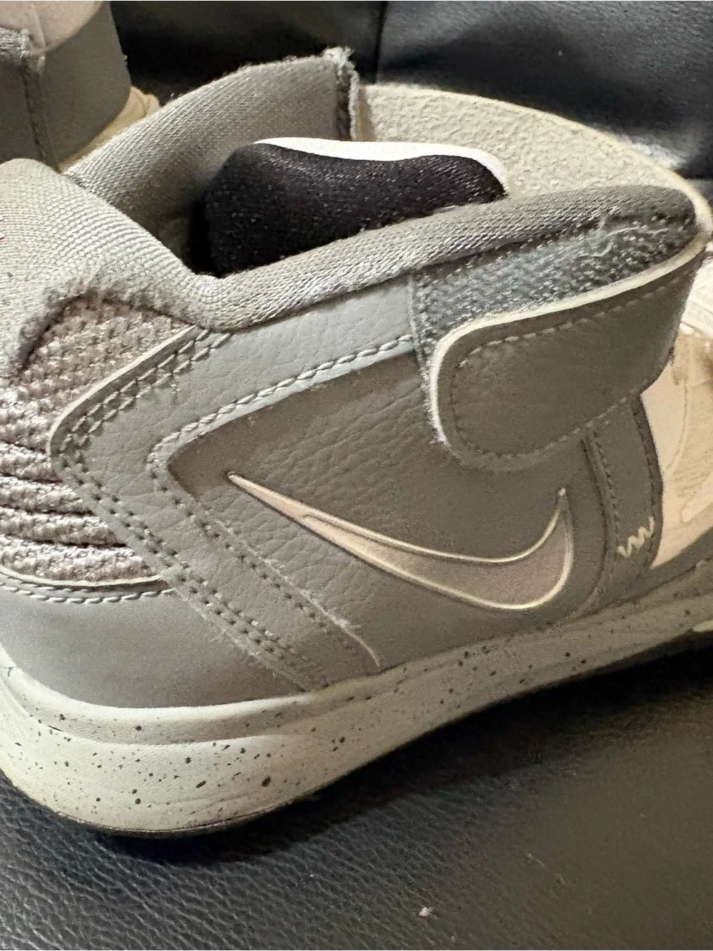 Nike Kids White Sneakers with Silver Signature Accent